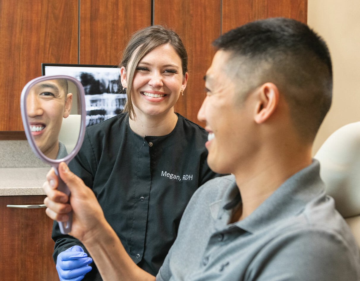 Patient looking at this smile in a handheld mirror